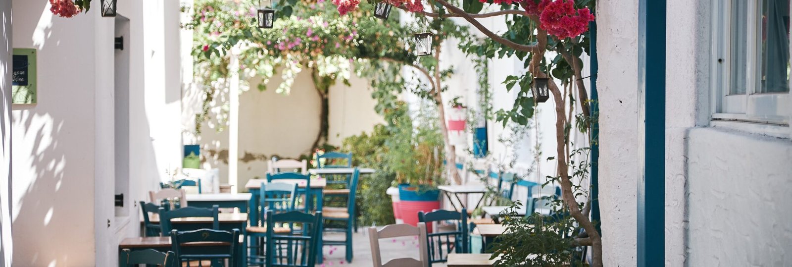 A beautiful shot of an outdoor cafe in the narrow bystreet in Paros, Greece