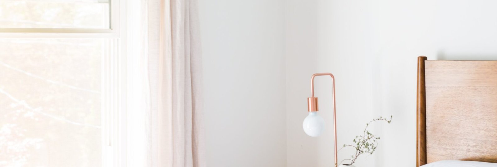 A copper lamp sits on a bedside table by a window in a brightly lit room, free public domain CC0 image.

More:

 View public domain image source here